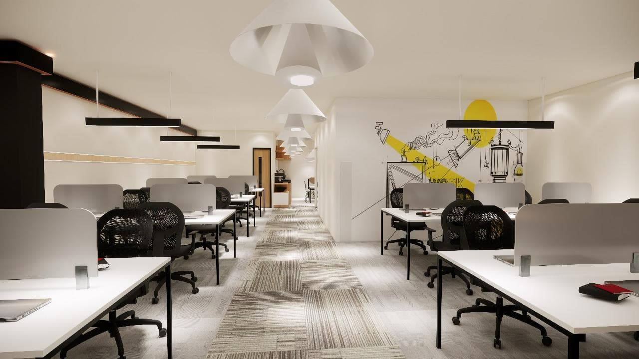 Shared work area with desks and soft lighting